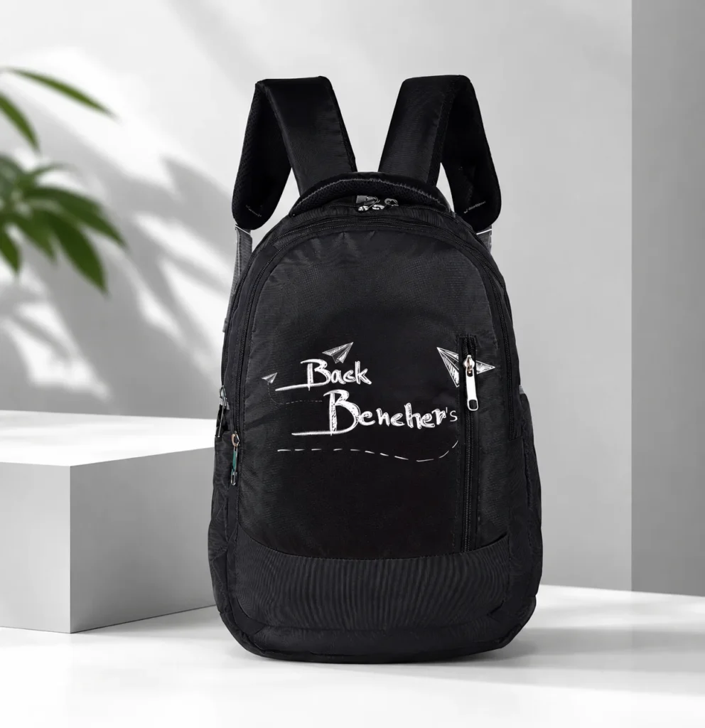 SKUGG black casual backpack with multiple zipper compartments, padded shoulder straps, and stylish printed front design.